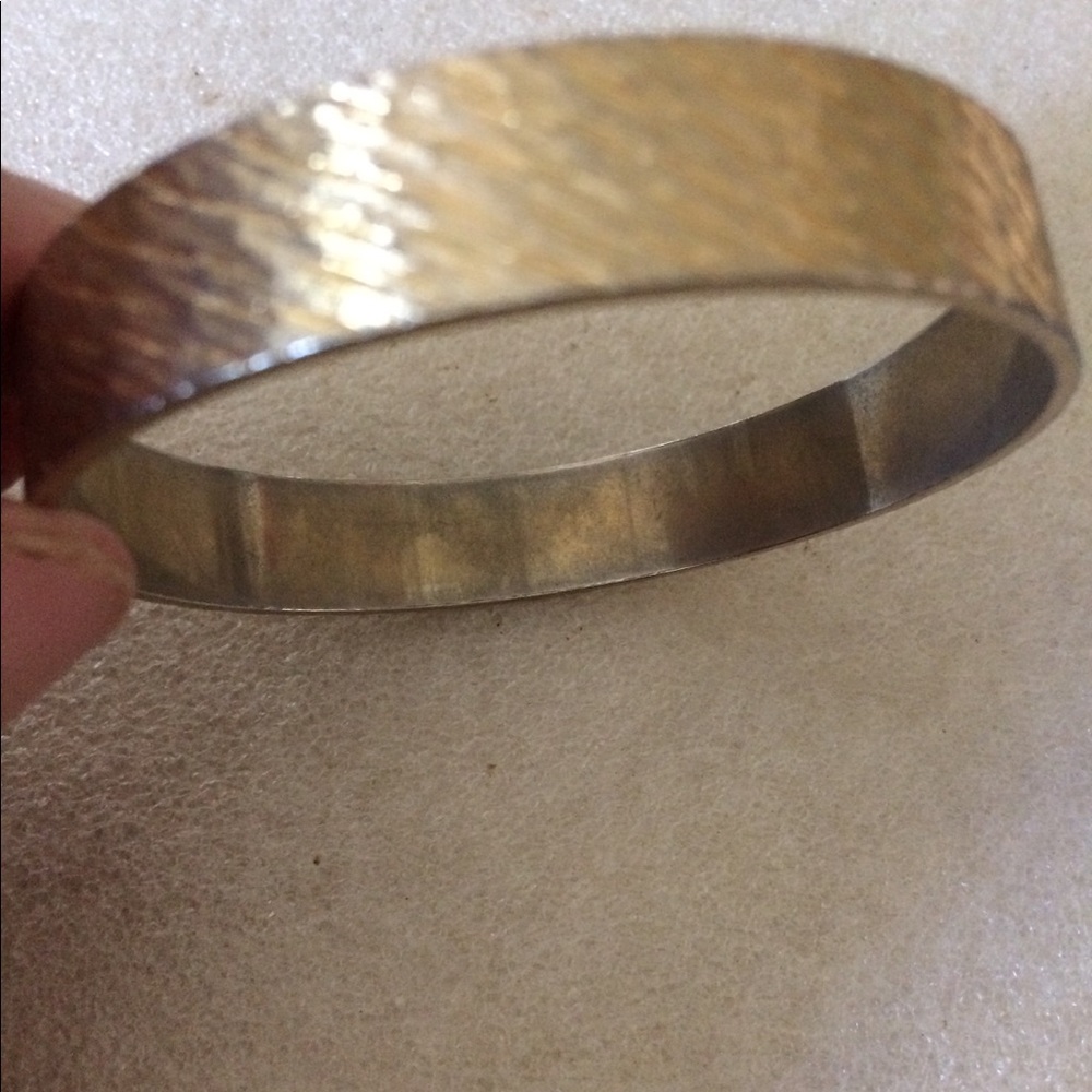 Gold tone bangle